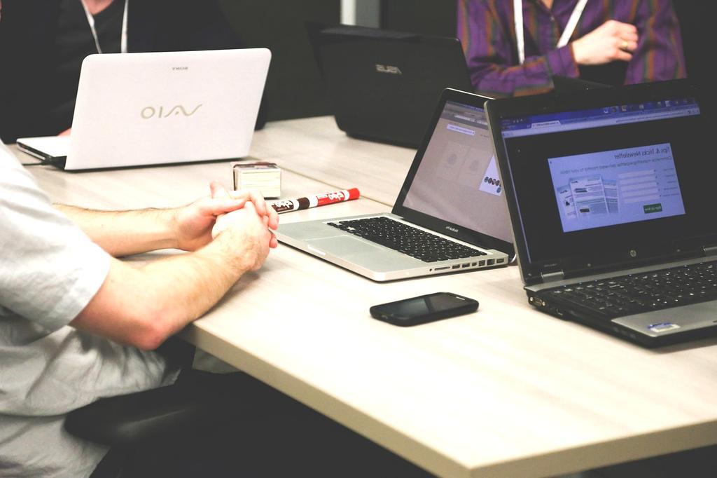 Journalist working at a laptop in a modern workspace